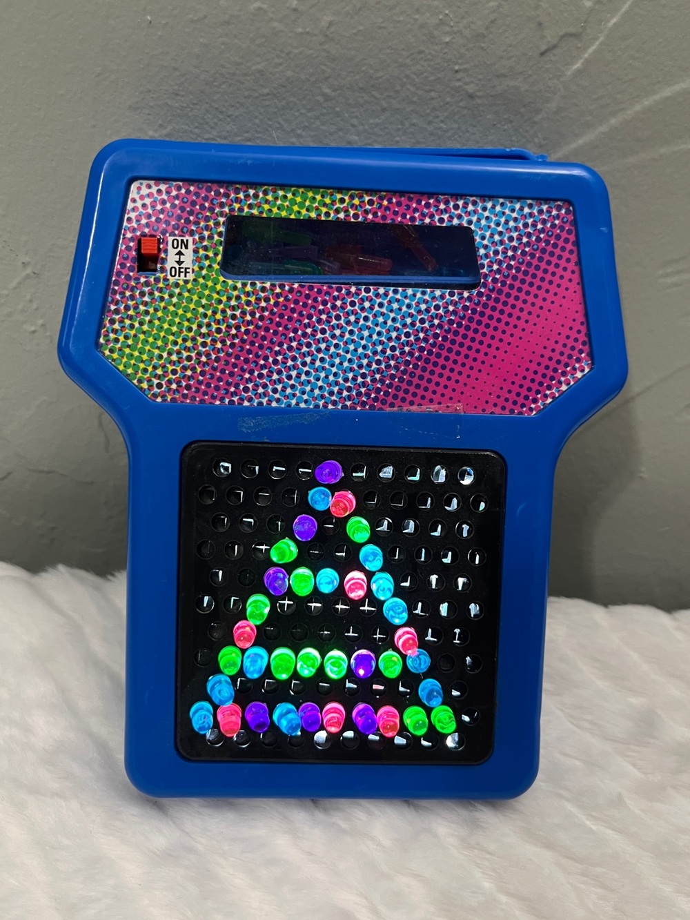 light‎ up hand held peg board toy